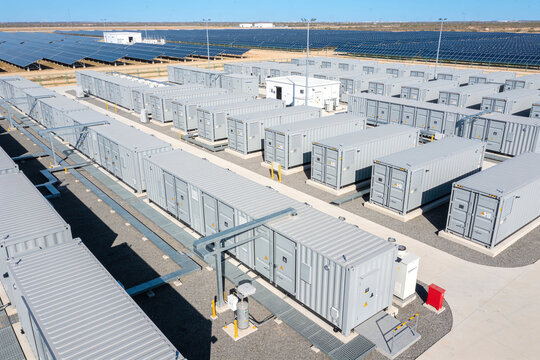 Renewable Energy & Sustainability &ndash; Aerial view of a large scale industrial battery energy storage system facility with rows of containers