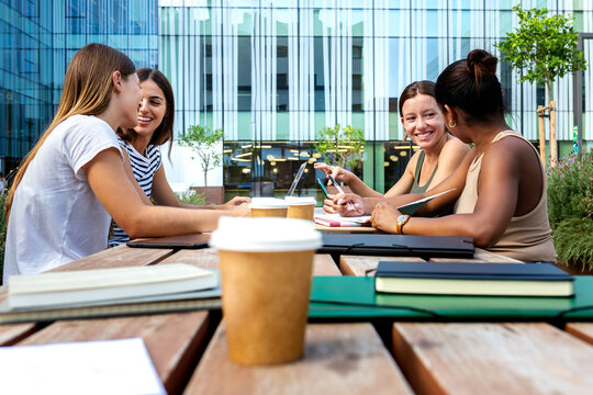 Diverse students collaborating on campus during coffee break
