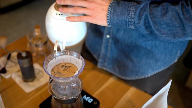 Man Making Pour Over Coffee With Slow Circular Brewing Motion