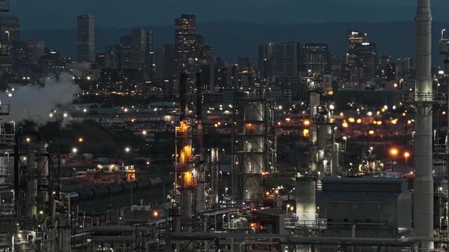 Refinery chimneys during evening night america close up mechanical drone video Denver Colorado 4K