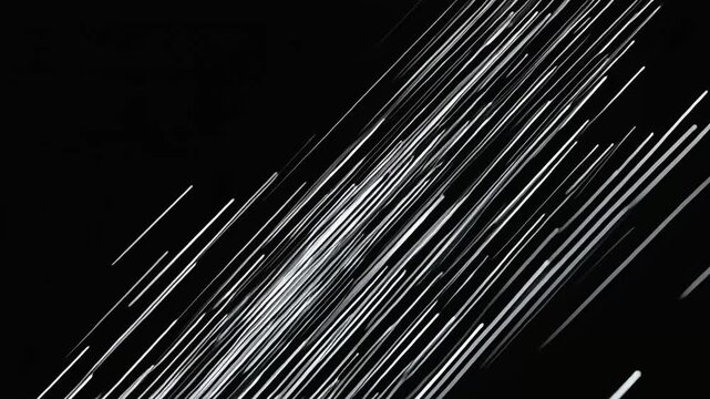 Diagonal white light streaks sweeping across black background