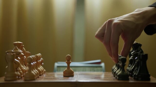 Chess Opening with First Captures and Chess Clock on Wooden Board Close Up 
