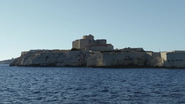 The famous Chateau d'If prison castle on If island, sailing by boat in the Mediterranean Sea