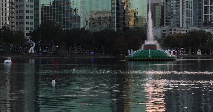Sunset view of the downtown skyline and Lake Eola of Orlando, Florida, USA.