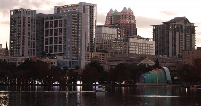 Sunset view of the downtown skyline and Lake Eola of Orlando, Florida, USA.