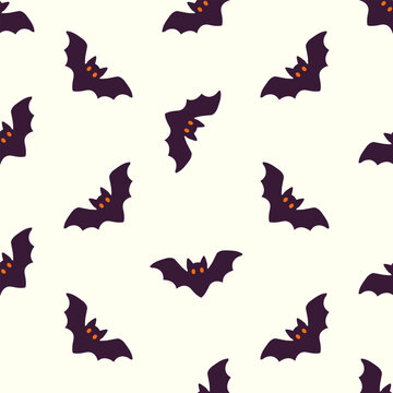 Cute purple bats with orange eyes flying on white background seamless illustration
