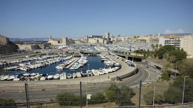 Aerial perspective of the beautiful Old Port of Marseille with yachts and boats on a sunny day
