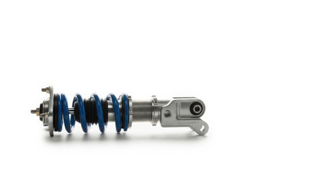 Performance automotive suspension shock absorber featuring a vibrant blue coil spring and metallic silver components isolated against clean white background