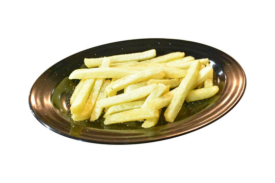 Crispy golden french fries served on black oval plate isolated on plain background