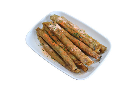 Crispy fried long spring rolls seasoned with chili powder isolated on plain background