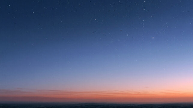 The night sky transitions into a soft dawn with a glowing horizon and a few bright stars shining above the distant earth before the morning sun appears