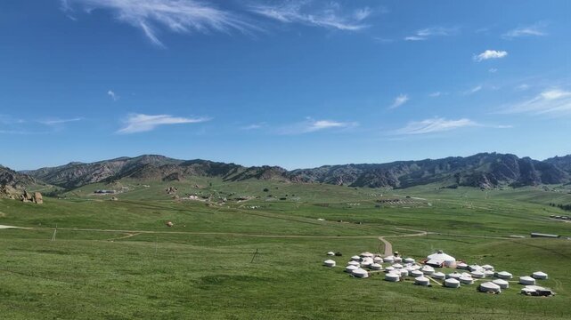 Beautiful green meadow, ger (yurt) and rock mountains landscape in Terelj National Park, Mongolia