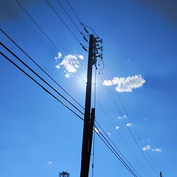 high voltage power lines with nice blue sky