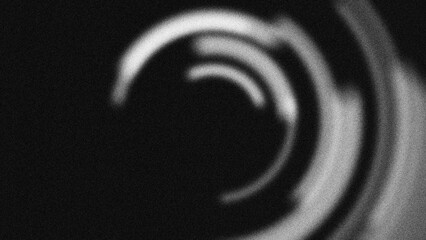 Fototapeta premium Abstract monochromatic circular pattern with grainy texture. Dynamic blurred concentric rings create a modern radial motion background