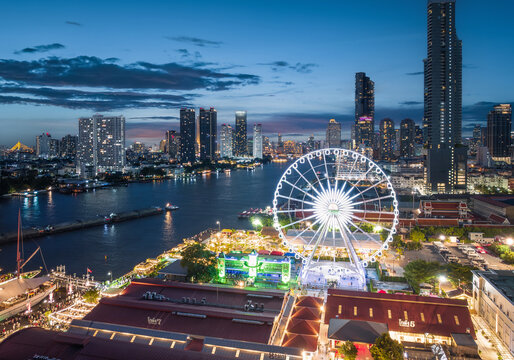 Aerial night view of the Ferris wheel at Asiatique The Riverfront on the Chao Phraya River, Bangkok, Thailand
