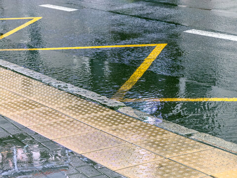 wet dark asphalt road and pavement surface after heavy rain.