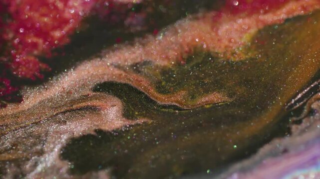 Glitter mix defocused. Ink flare. Liquid stream spill on wet light leak background. Red black brown particles abstract color texture.