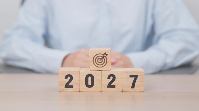  2027 year block with dartboard icon. Goal, Target, Resolution, strategy, plan, Action, mission, motivation, and New Year start concepts