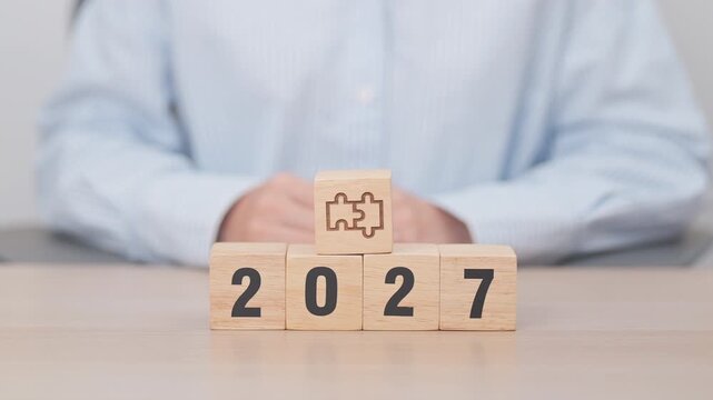 2027 year block with jigsaw puzzle icon. Business Process, Team, teamwork, Goal, mission, Resolution, strategy, plan, Action, partnership, and New Year start