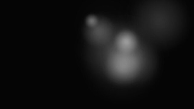 Black ink drops blooming in water abstract background