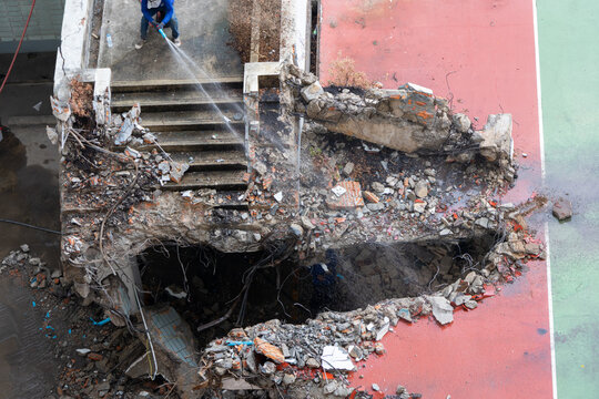 Building Demolition and Water Spraying Work