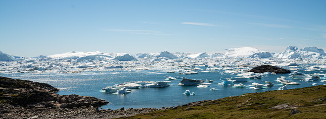 Greenland landscape nature with icebergs and ice in Greenland icefjord. Aerial drone panoramic banner photo of Ilulissat Icefjord with icebergs from Jakobshavn Glacier. © Maridav