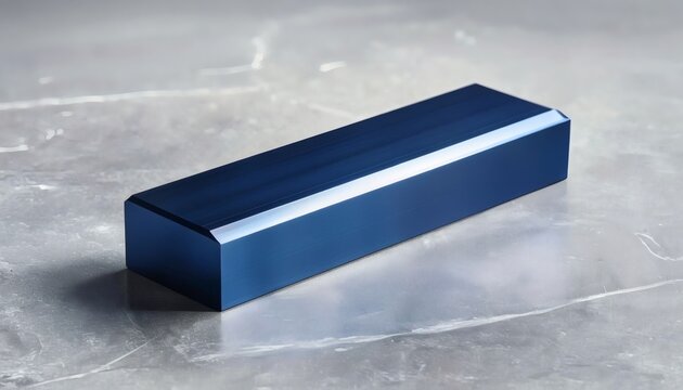 Deep blue anodized aluminum billet on light grey stone surface