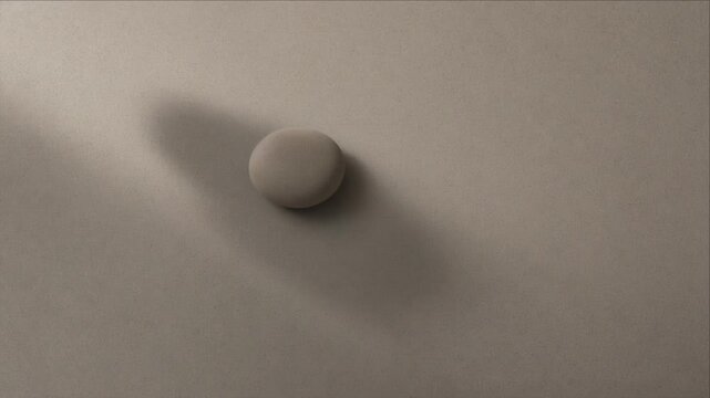 Minimal top view of smooth oval object casting long soft shadow across neutral matte surface, with subtle texture, warm gentle light, minimal background, calm abstract composition and depth
