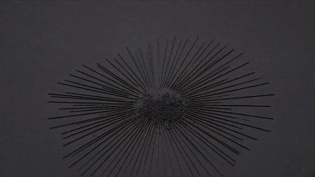 Minimal dark black radial pattern top view with fine line and brush texture abstract geometric background, creating moody dramatic depth, granular surface, subtle contrast, and spacious copy space