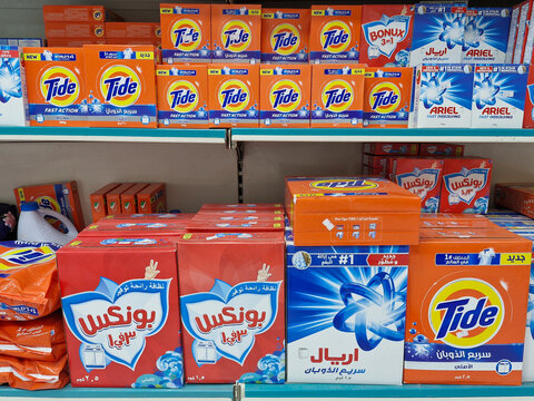 Display of major laundry detergent brands including Tide, Ariel, and Bonux 3in1 boxes at Wadi Al Fora'a shop in Jeddah - Madinah highway