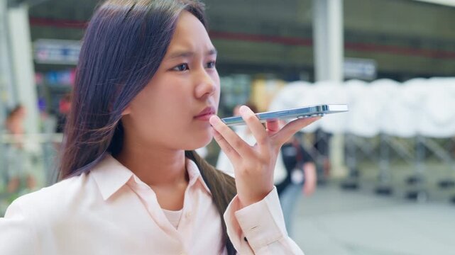 woman talking and command an AI voice assistant on a smartphone as a conceptual backdrop for artificial intelligence technology communication phone innovation virtual assistant and smart lifestyle