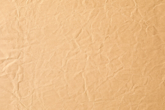 crumpled matte brown paper background texture