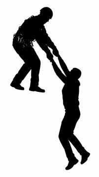 Silhouette of a person reaching out to pull another person up to safety.
