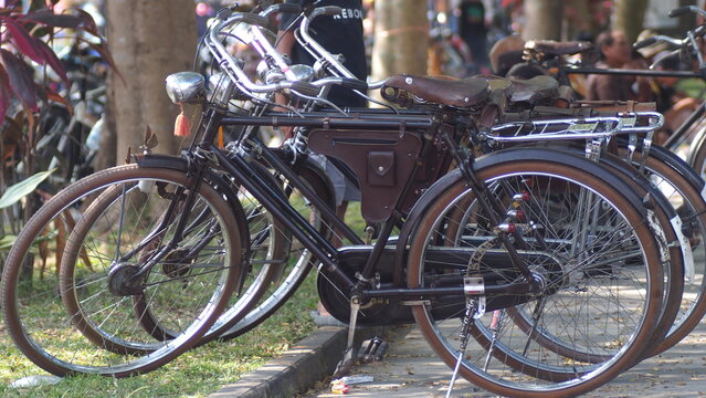 Row of Classic Vintage Onthel Bicycles Parked on the Roadside for Community Gathering