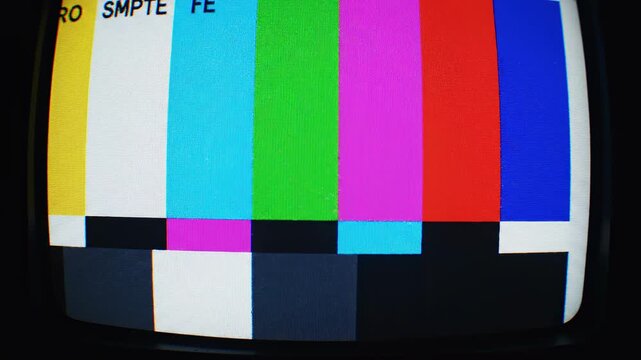 Television test pattern signal with static during a broadcast interruption in a dark studio
