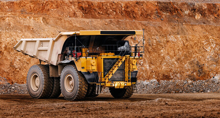 Heavy dump truck in open pit quarry with oversized tires for construction background and industrial transport equipment © Parilov