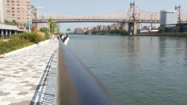 New York City Manhattan Midtown, Queensboro bridge architecture, United States. Urban transport metallic bridge to Queens and Roosevelt island, East River. Esplanade in East Side. Urban promenade park