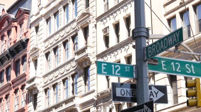 New York City Broadway street sign on Manhattan, United States. Urban road sign in american city. Traffic sign in Midtown of NYC, USA. Building architecture in residential district near Union Square.