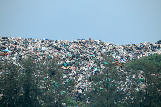 Grim landfill mountain reveals urgent solid waste management challenge and pollution danger harming natural environment outdoors