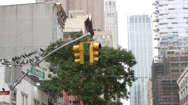 New York City Church street sign in Lower Manhattan, United States. Urban road sign and traffic light in american NYC. Building architecture, Tribeca district from Soho. Pigeon birds and Leonardo st.