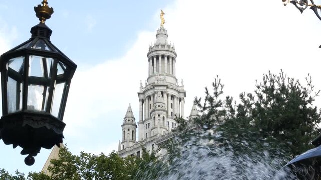 New York City Downtown Civic Center, United States of America. Manhattan municipal building 1914, old historic architecture. Government administration authority from City Hall park. Fountain, lantern.