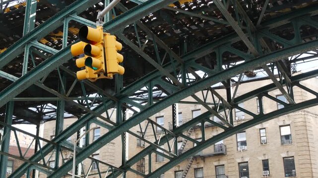 New York City 125 street elevated subway metro metallic bridge in Harlem, United States. American transport, Manhattan. Old outdoor metropolitan station, NYC USA. Historic architecture, traffic light.