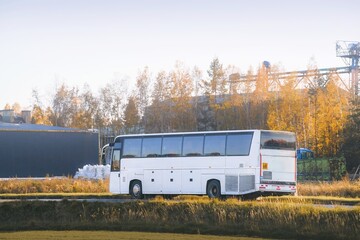 White bus driving on sunny highway © AlexGo