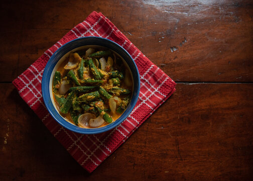 Dahi Bhindi or Okra made with yogurt and Indian spices seved in a bowl. Close up, selective focus.