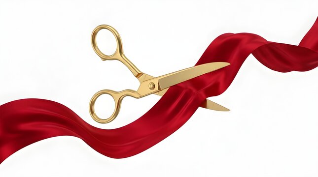 Golden decorative scissors cutting through red velvet ribbon with elegant sheen