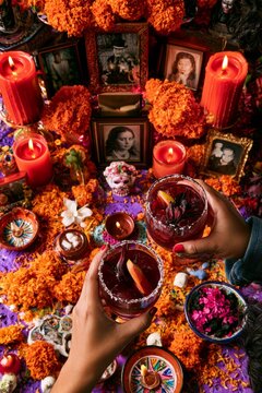 Day of the Dead Memorial Toast with Red Cocktails and Ofrenda