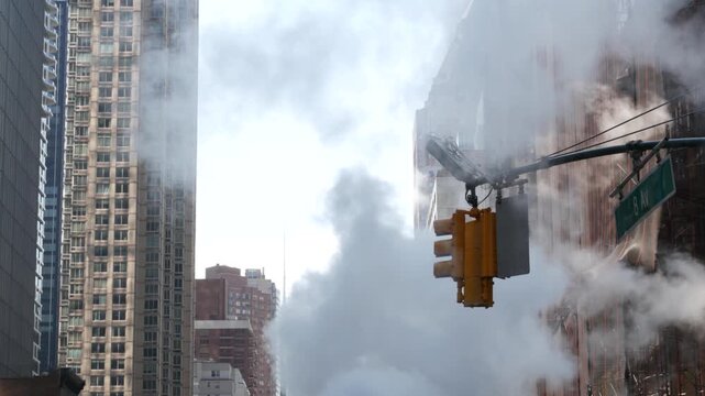 New York City Midtown urban tall buildings architecture, Manhattan straight street, 8th eights avenue, United States of America. Skyscraper towers near Columbus Circle, USA. Hot steam smoke vapor.