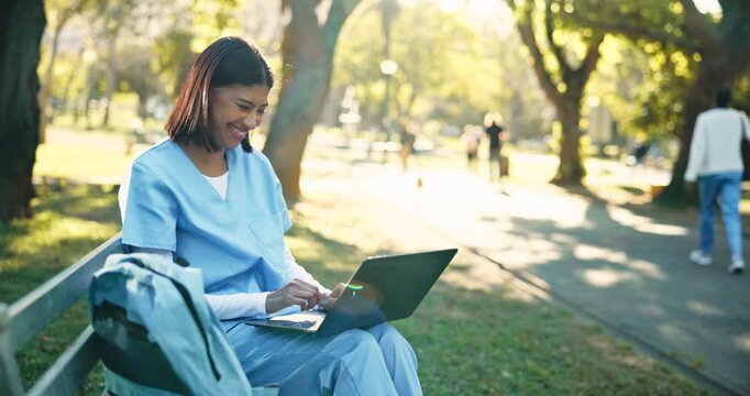 Woman, medical student and excited in park with laptop, program selection and submit assignment. Happy, education and trainee nurse with tech for research, typing and apply for scholarship on bench