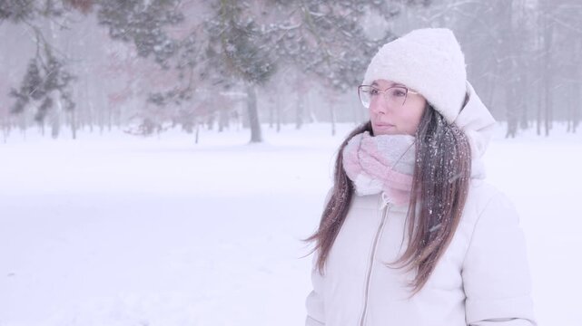 Woman outdoor calm. Female looking aside during snowy day. Peaceful solitude concept.