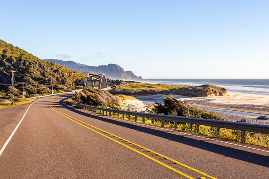 A view of the coastal highway illuminated by the sunset rays